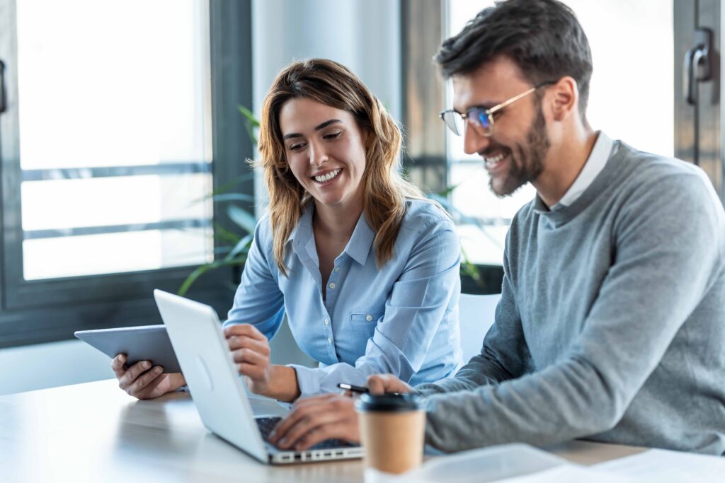 Smart business people working with plans while talking of their new design business in the office